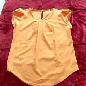 Women’s orange blouse